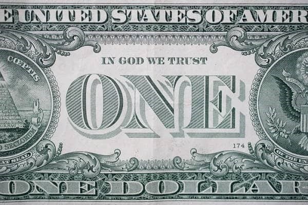 معنی نوشته‌های روی دلار